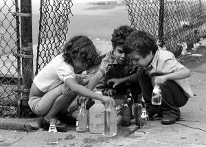 Kids playing with water from hydrant, Lower East Side, 1978